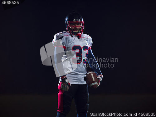 Image of portrait of confident American football player