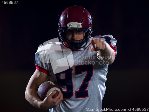 Image of portrait of confident American football player