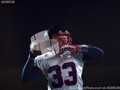 Image of american football player throwing rugby ball