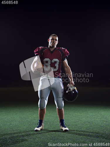 Image of portrait of young confident American football player