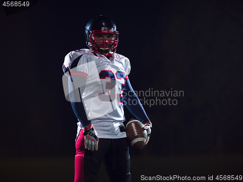 Image of portrait of confident American football player