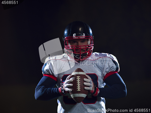 Image of portrait of confident American football player