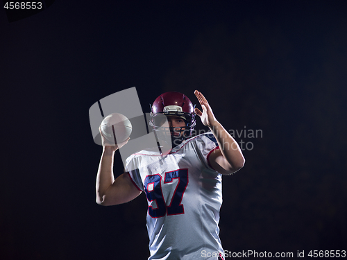 Image of american football player throwing rugby ball