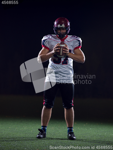 Image of portrait of confident American football player