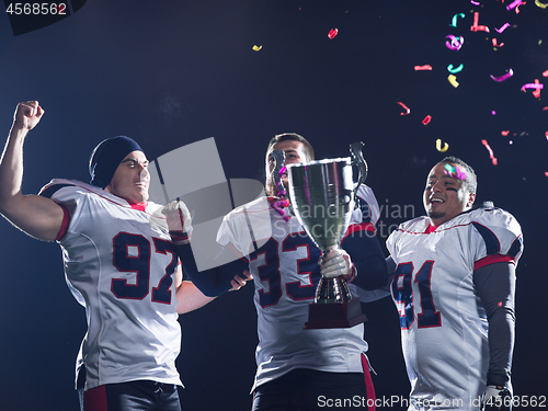 Image of american football team celebrating victory