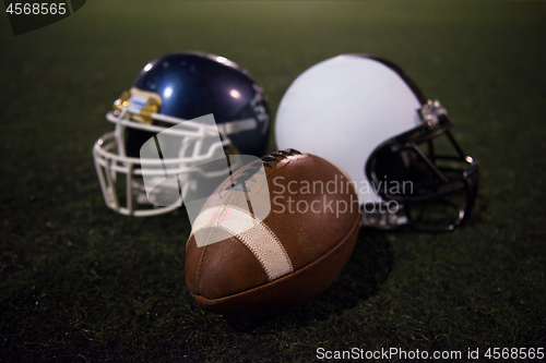 Image of american football and helmets