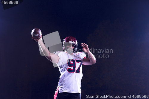 Image of american football player throwing rugby ball