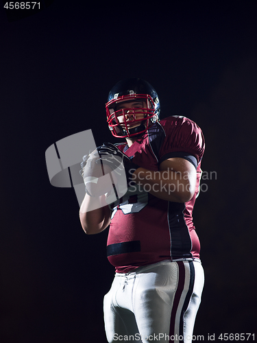 Image of portrait of confident American football player