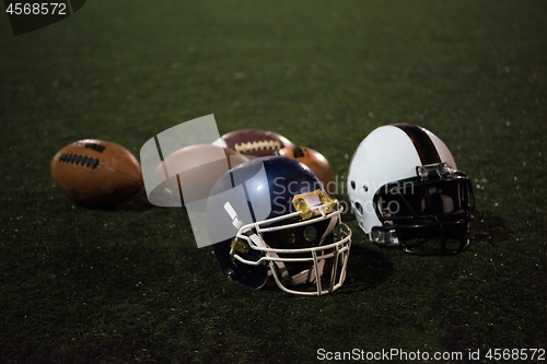 Image of american football and helmets