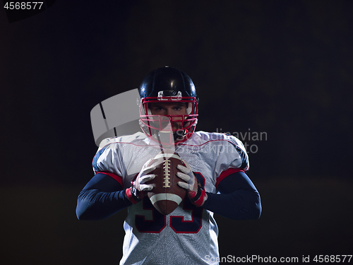 Image of portrait of confident American football player