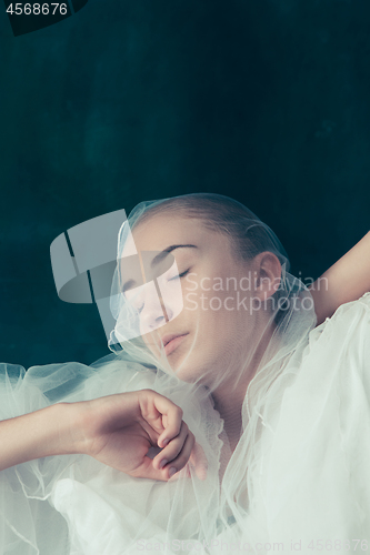 Image of Beautiful bride looking over her veil