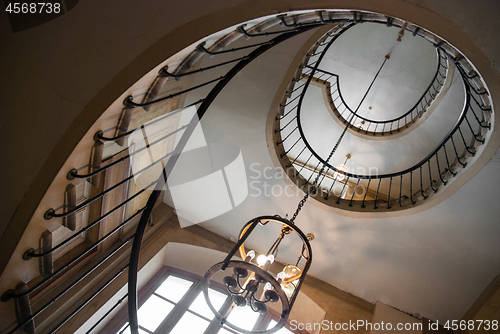 Image of Paris, France - August 05, 2006: Spiral staircase and vintage chandelier in the gallery of Vivienne. Paris