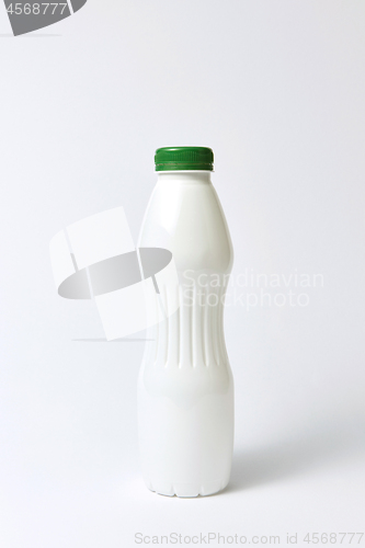 Image of White plastic bottle mock up for yogurt on a light background.