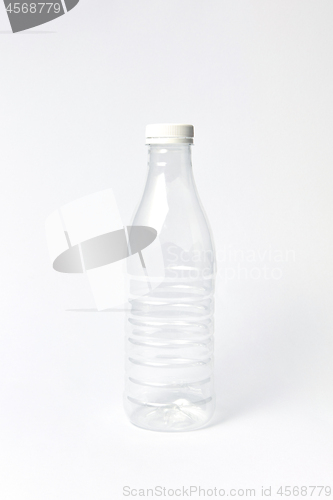 Image of Empty plastic bottle mock up for water on a light background.