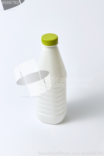 Image of Mock-up dairy bottle from plastic on a light background.