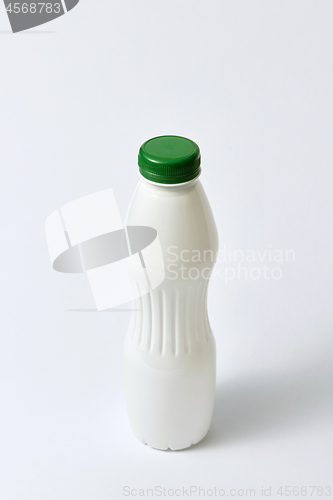 Image of Mock up plastic white bottle for dairy on a light background.