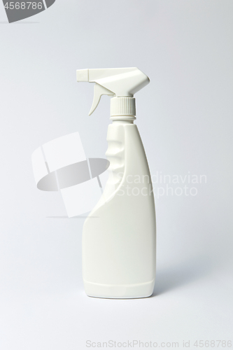 Image of Mock up plastic spray detergent bottle on light background.
