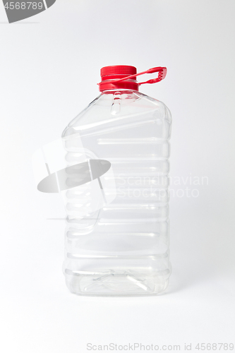 Image of Plastic transparent canister for water on a light bakground. Mock up.