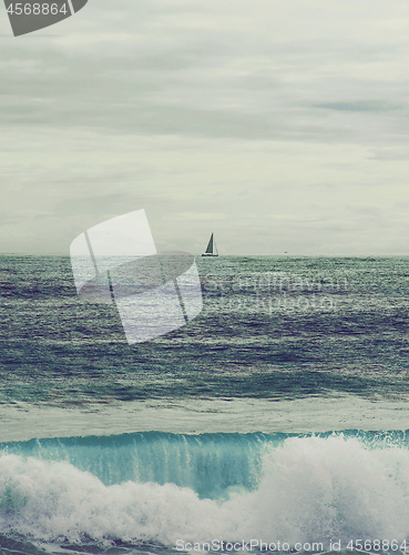 Image of Lonely Sailboat on Horizon