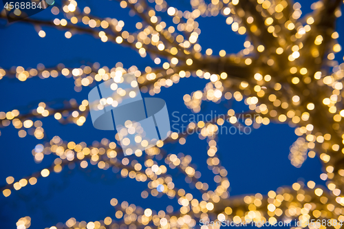 Image of Blurred golden lights on Christmas Tree