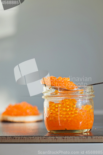 Image of Macro shot of red caviar on jar