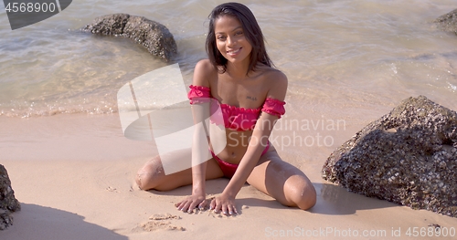 Image of Tender woman traveler in swimwear at seashore