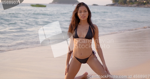 Image of Carefree female chilling in water on beach