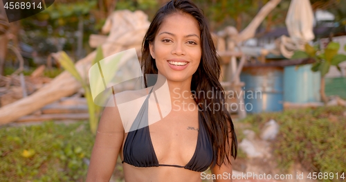 Image of Smiling woman enjoying rest in tropical area