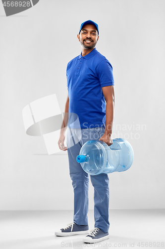 Image of happy indian delivery man with water barrel