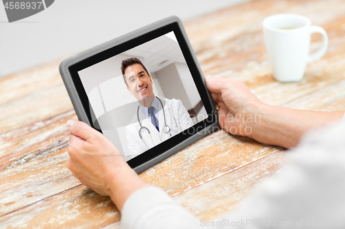 Image of senior woman patient having video call with doctor