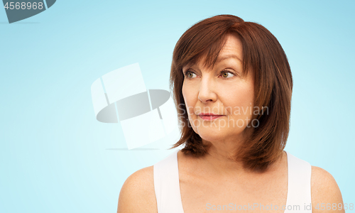 Image of portrait of senior woman over white