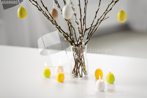 Image of pussy willow branches decorated by easter eggs