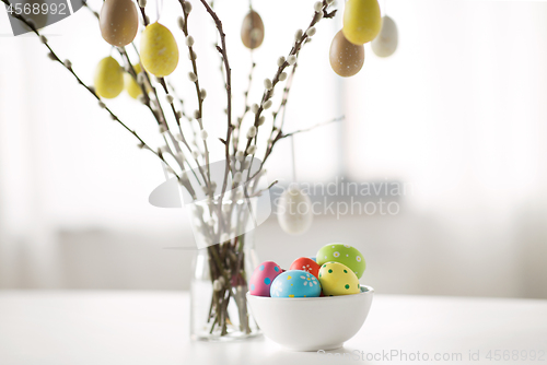 Image of pussy willow branches decorated by easter eggs