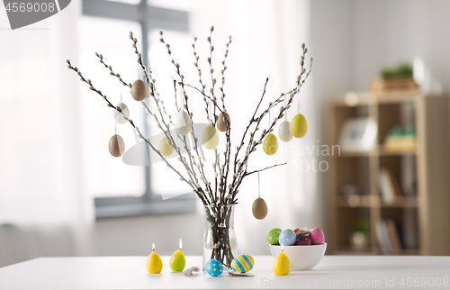 Image of pussy willow branches decorated by easter eggs