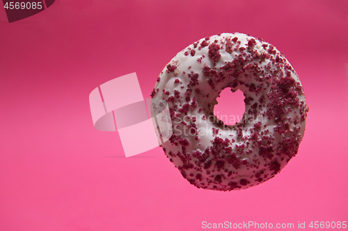 Image of Macro shoot of donut on pink