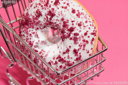 Image of Macro shoot of donut on pink