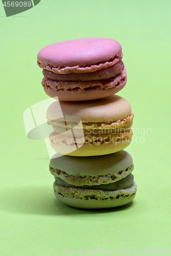 Image of Macro shot of stack of macarons over green mint background