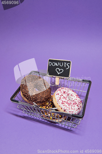 Image of Macro shoot of donuts over purple