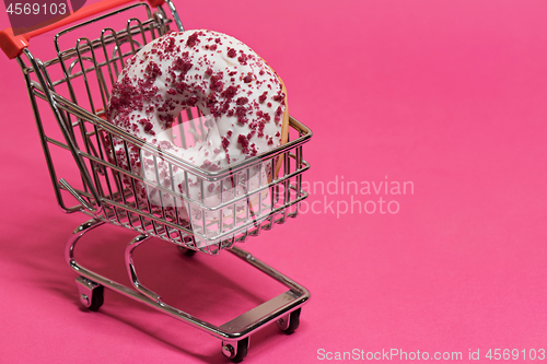 Image of Macro shoot of donut on pink