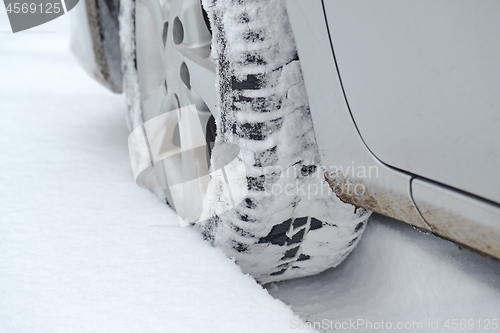 Image of Car tyre in snow