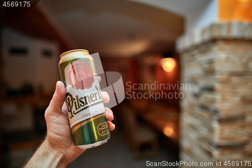 Image of Holding beer in a house