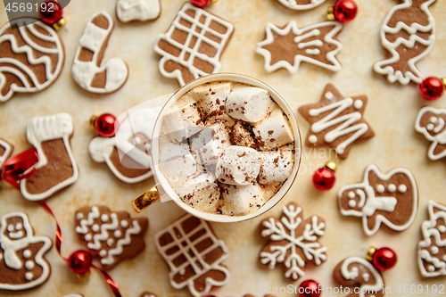 Image of Cup of hot chocolate and Christmas shaped gingerbread cookies