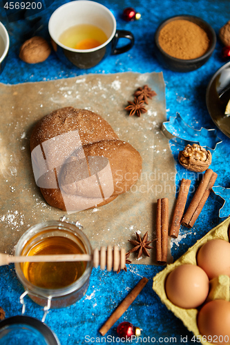 Image of Gingerbread dough placed among various ingredients. Christmas baking concept