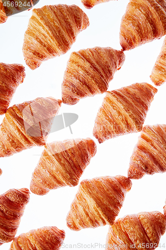 Image of Diagonal baked goods pattern on a light background.