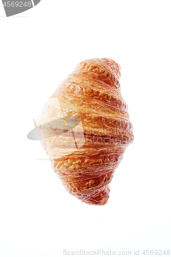 Image of Close up french freshly baked croissant on a white background.