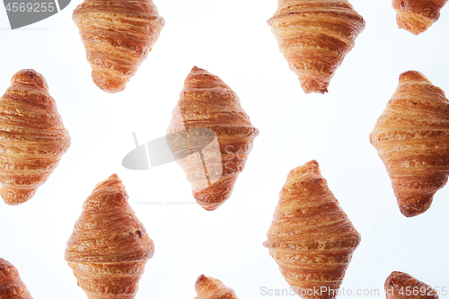 Image of Homemade french croissants pattern on a white background.