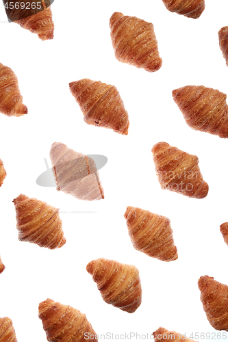 Image of Diagonal bakery french croissants pattern on a white background.