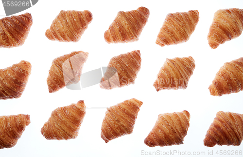 Image of Bakery fresh croissants pattern on a white background.