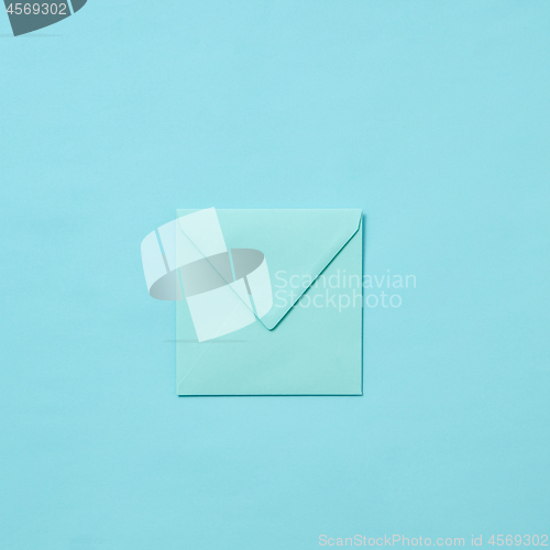 Image of Blank craft envelope, mock-up on a pastel background.