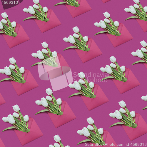 Image of Decorative background with gift envelopes of tulips flowers on a